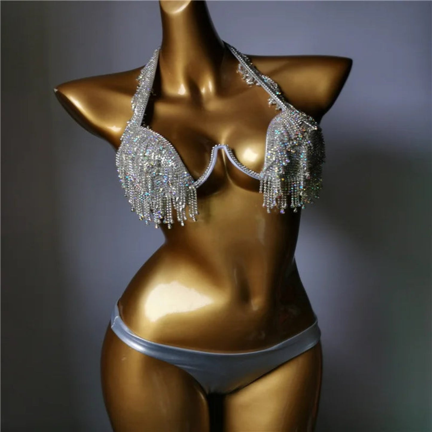 Side angle of rhinestone bikini showing diamond fringe detail and shimmering movement.