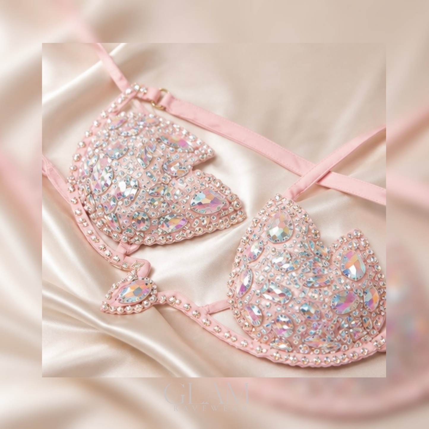 Baby pink Diamond Dreams rhinestone festival bikini top shown in a flat lay with shimmering crystal embellishments, boutique styling, and luxury GLAM Ravewear aesthetic.