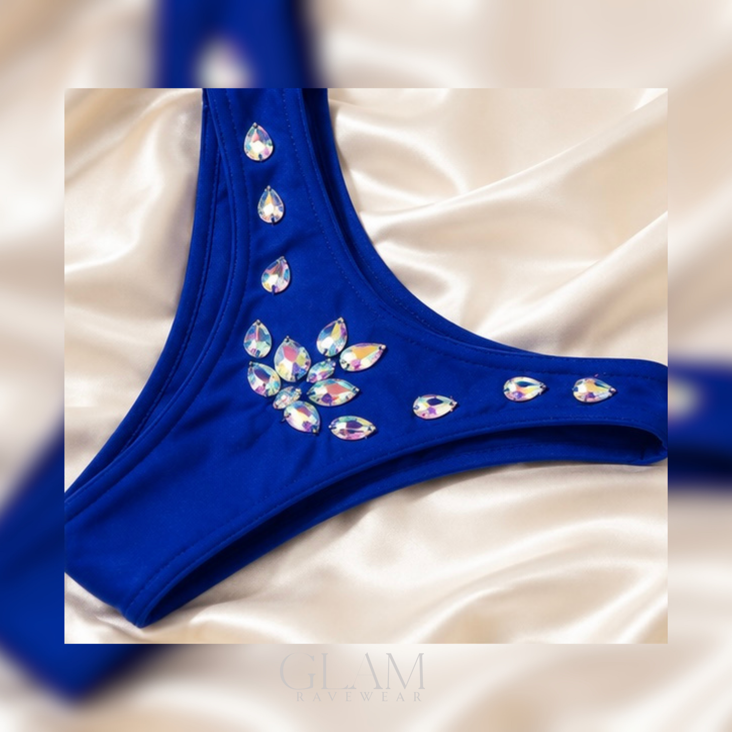 Blue Diamond Dreams rhinestone festival outfit shown in a flat lay with shimmering rhinestone embellishments, matching two-piece design, and luxury GLAM Ravewear aesthetic.